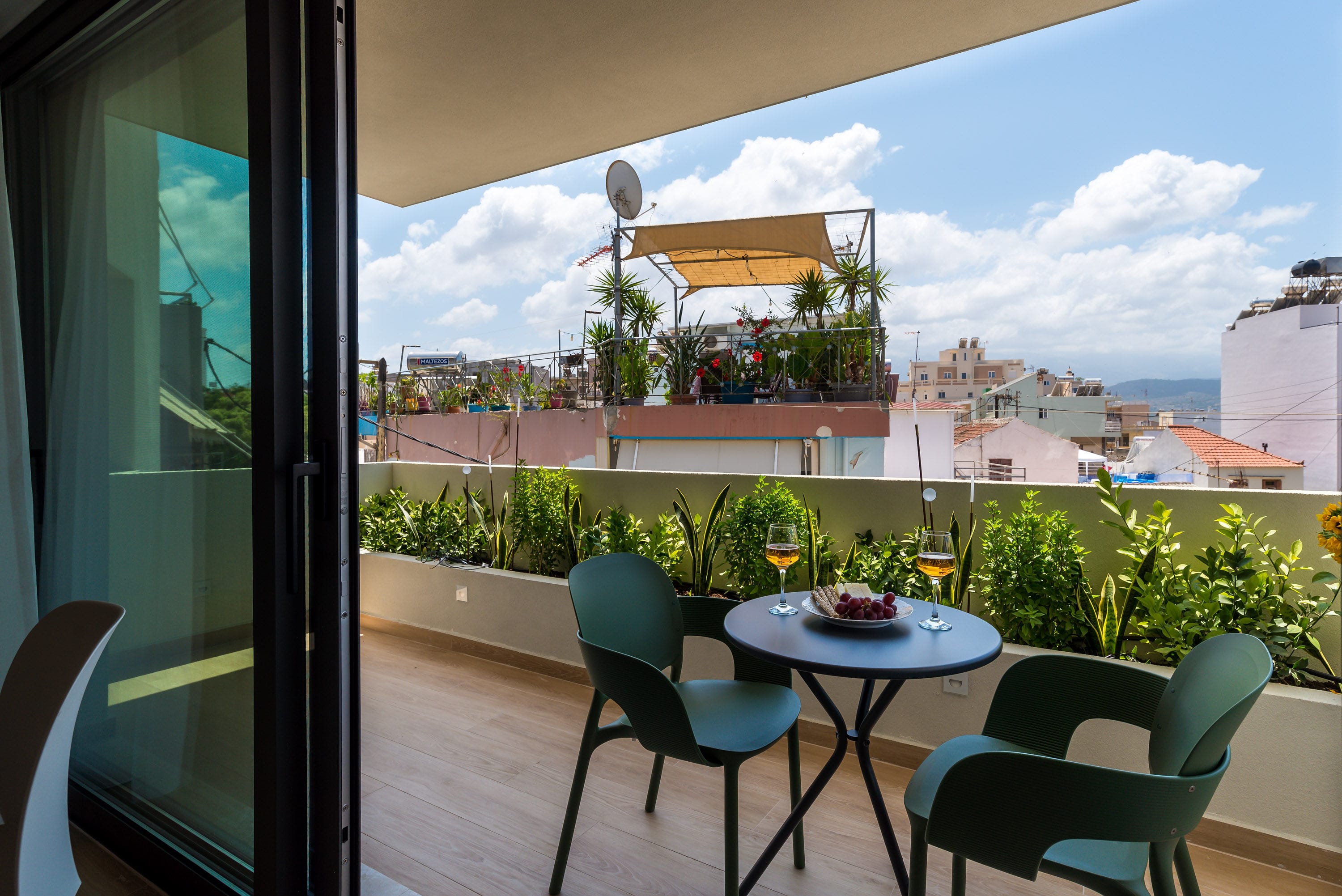 a table and chairs on a balcony