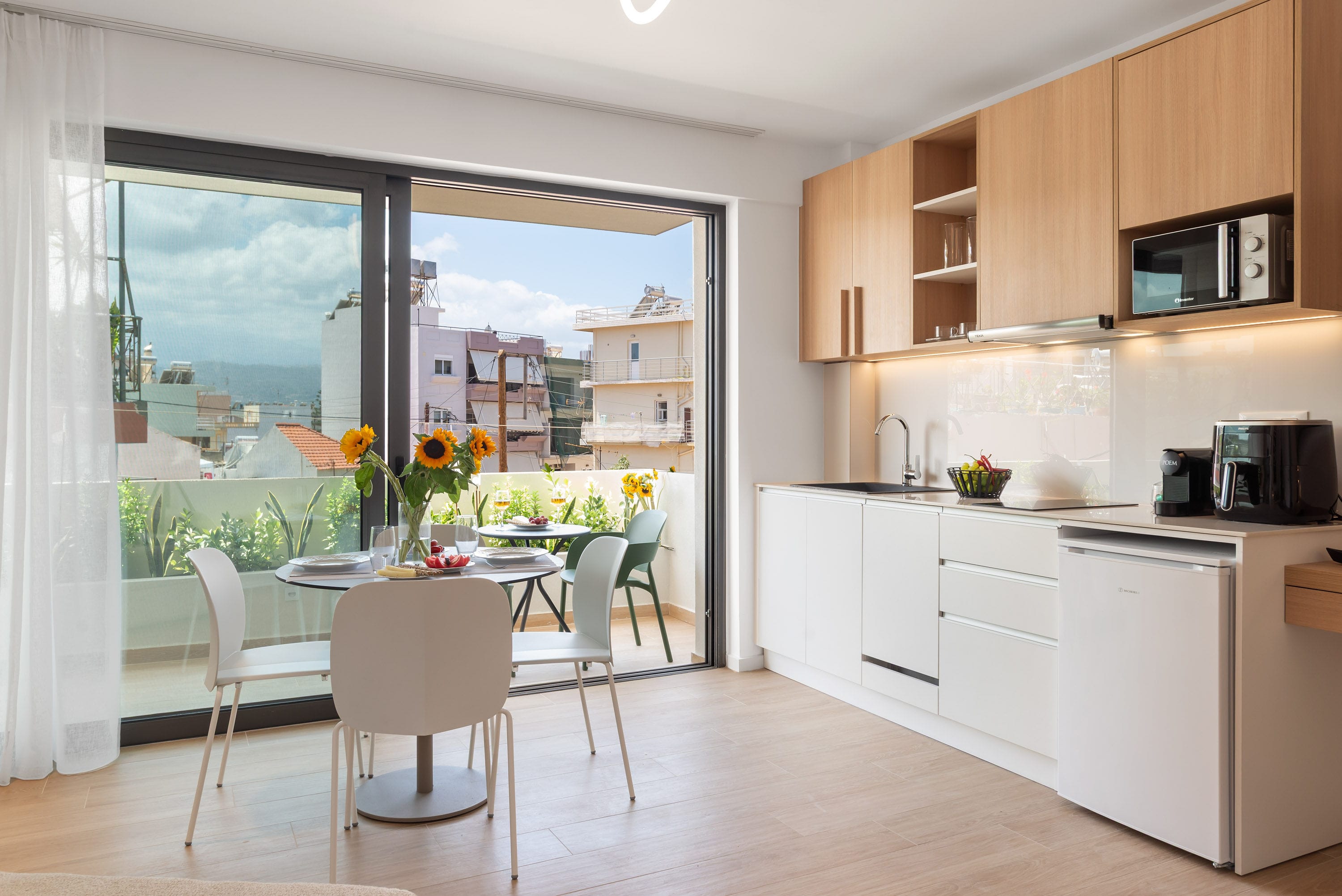 a kitchen with a table and chairs