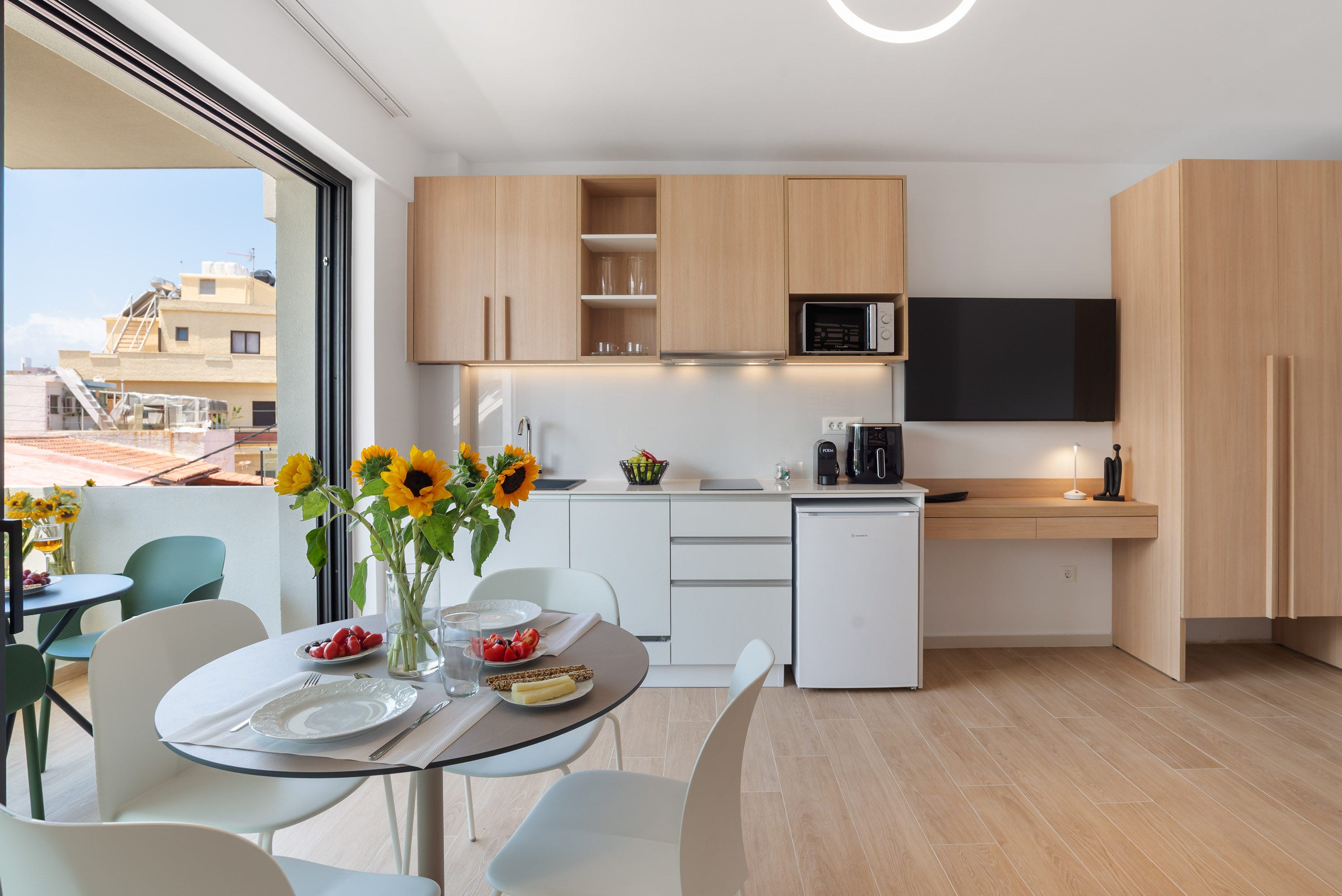a kitchen with a table and chairs