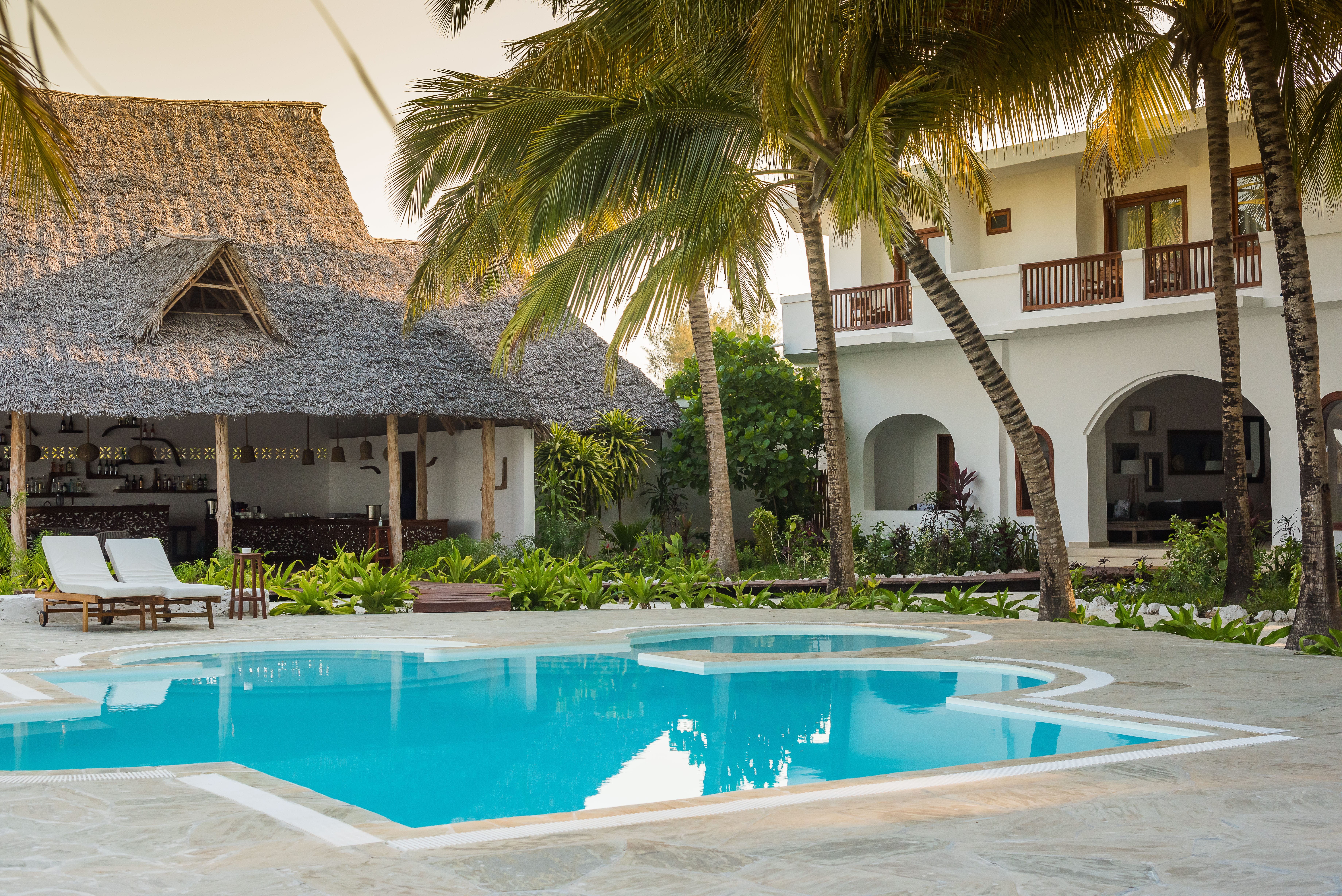 a pool in front of a house