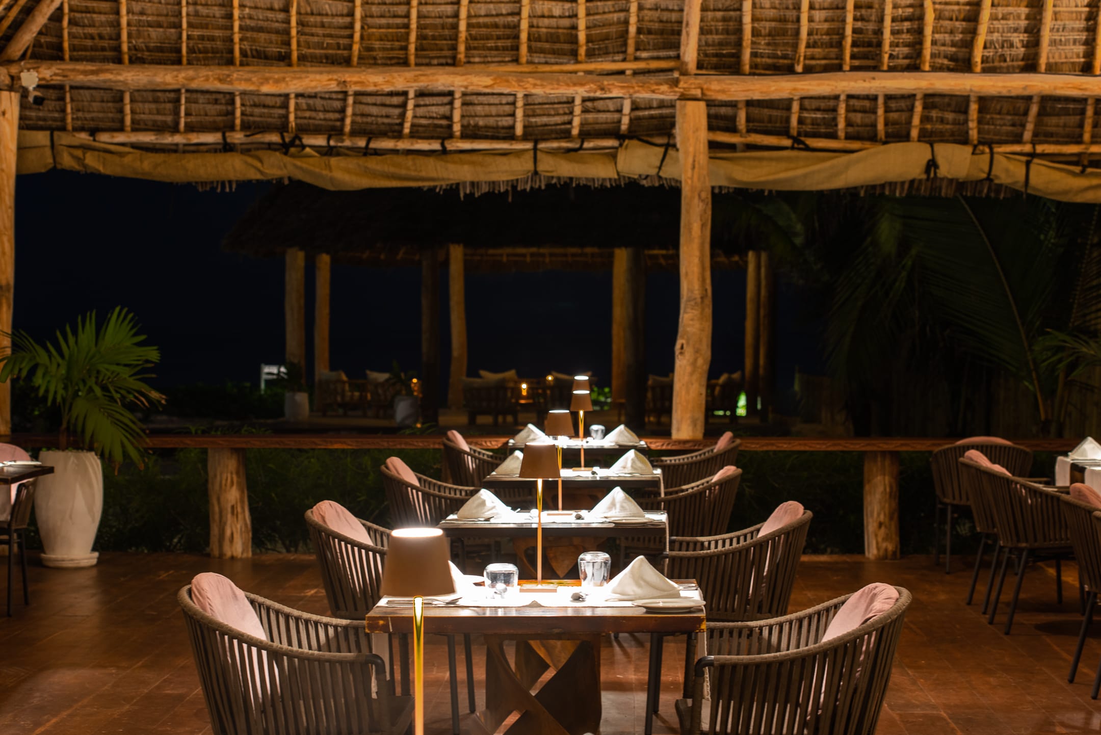 a table with a set of chairs and a large wood structure