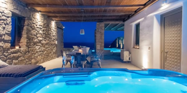 a pool with a table and chairs