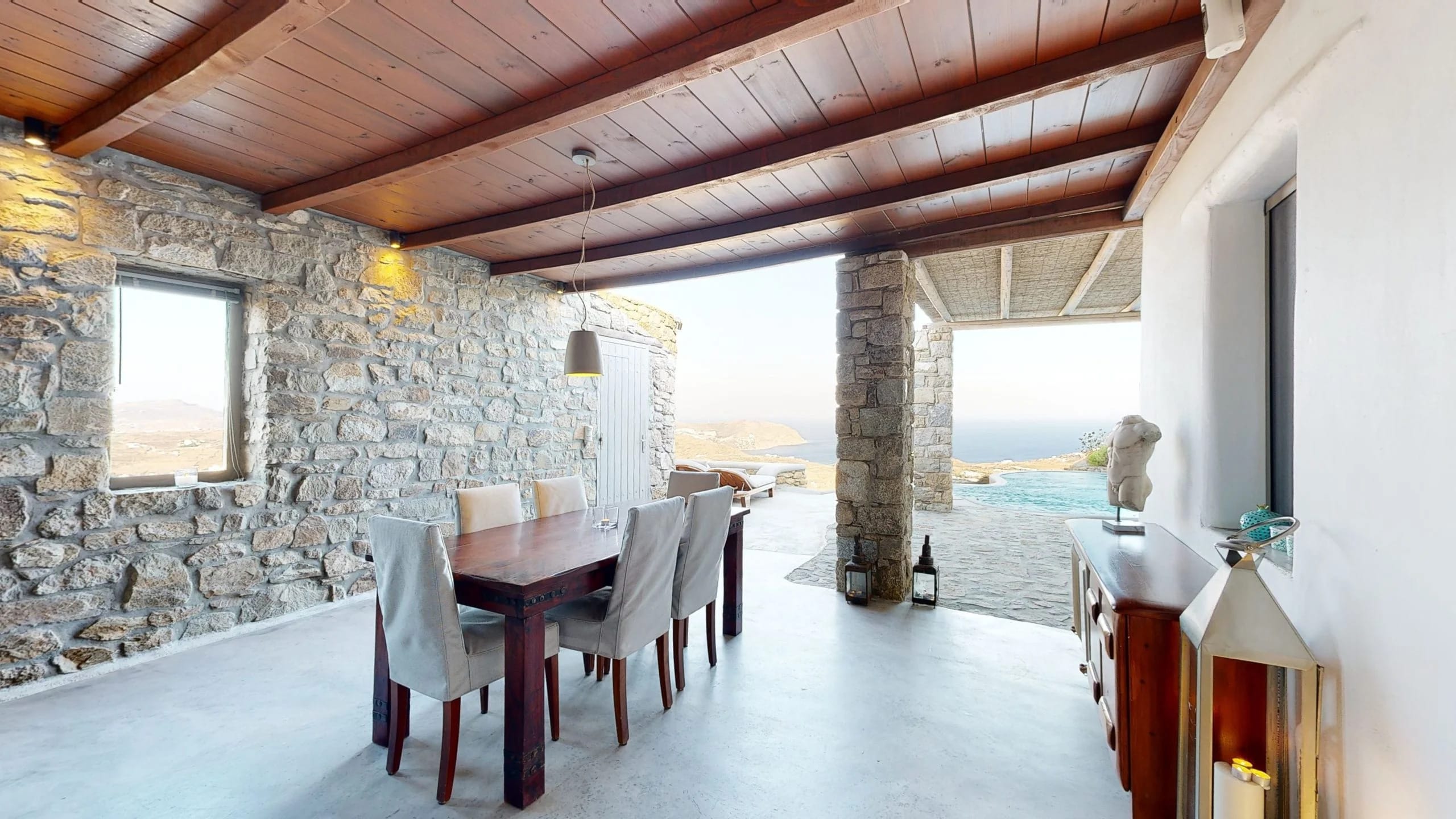 a dining room with a table and chairs