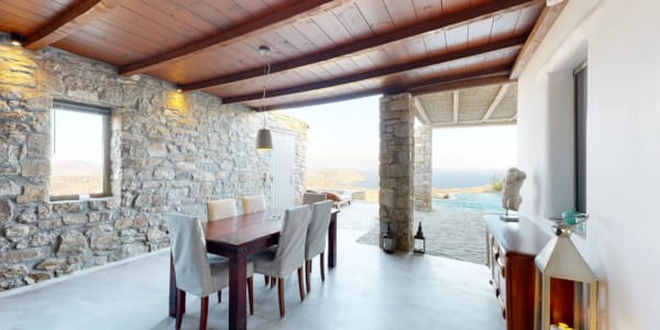 a dining room with a table and chairs