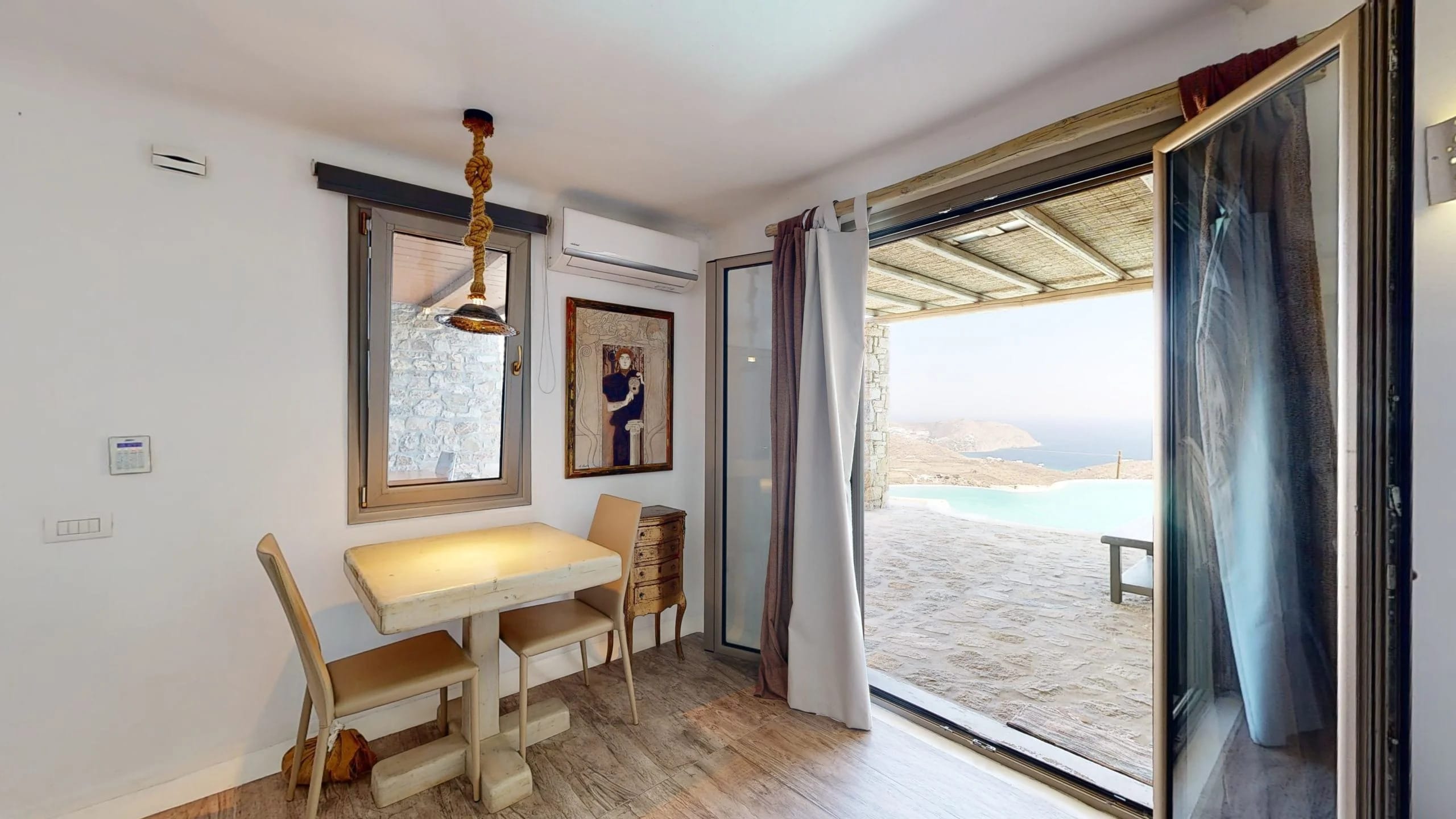 a room with a table and chairs