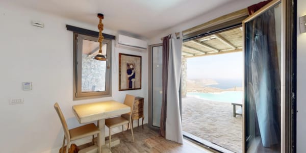 a room with a table and chairs