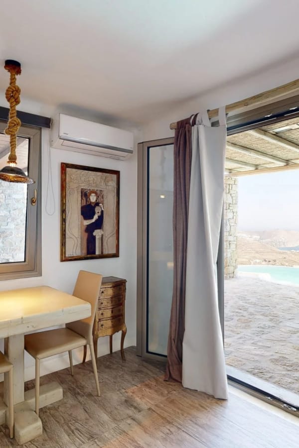 a room with a table and chairs