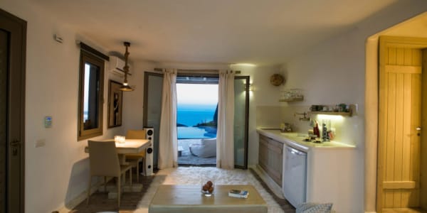 a living room with a view of the ocean