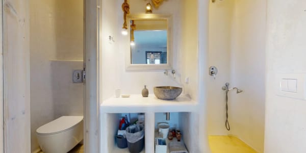 a bathroom with a sink and toilet