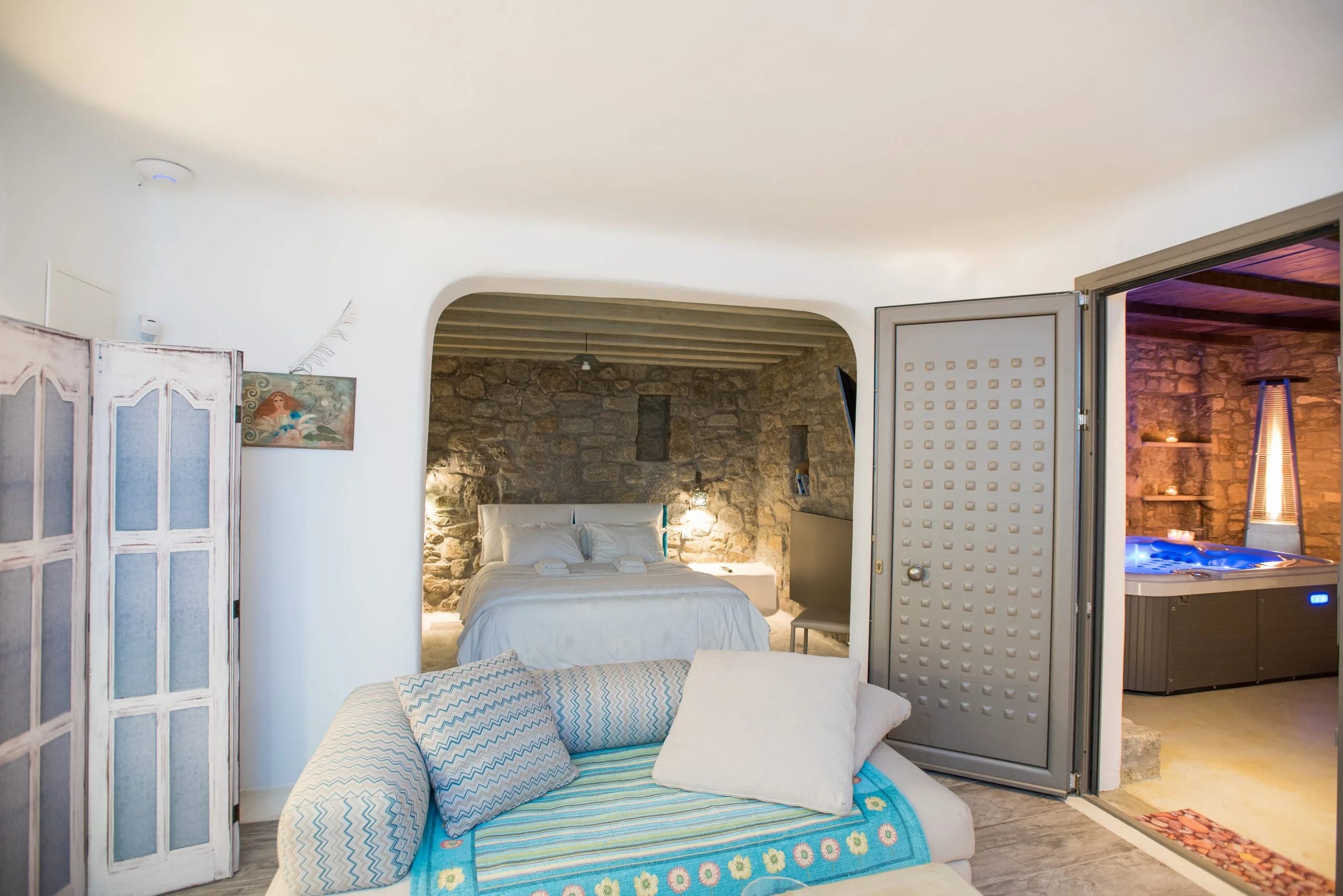 a living room with a couch and a fireplace