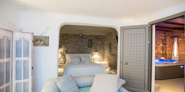 a living room with a couch and a fireplace