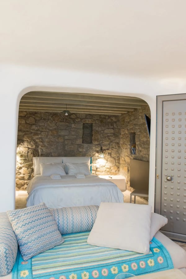 a living room with a couch and a fireplace