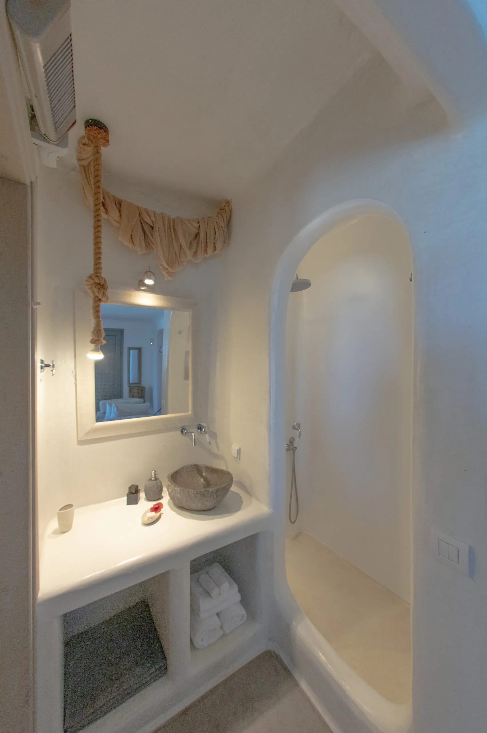 a bathroom with a bathtub and a mirror