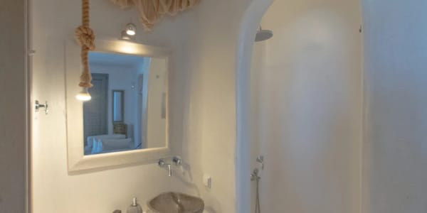 a bathroom with a bathtub and a mirror