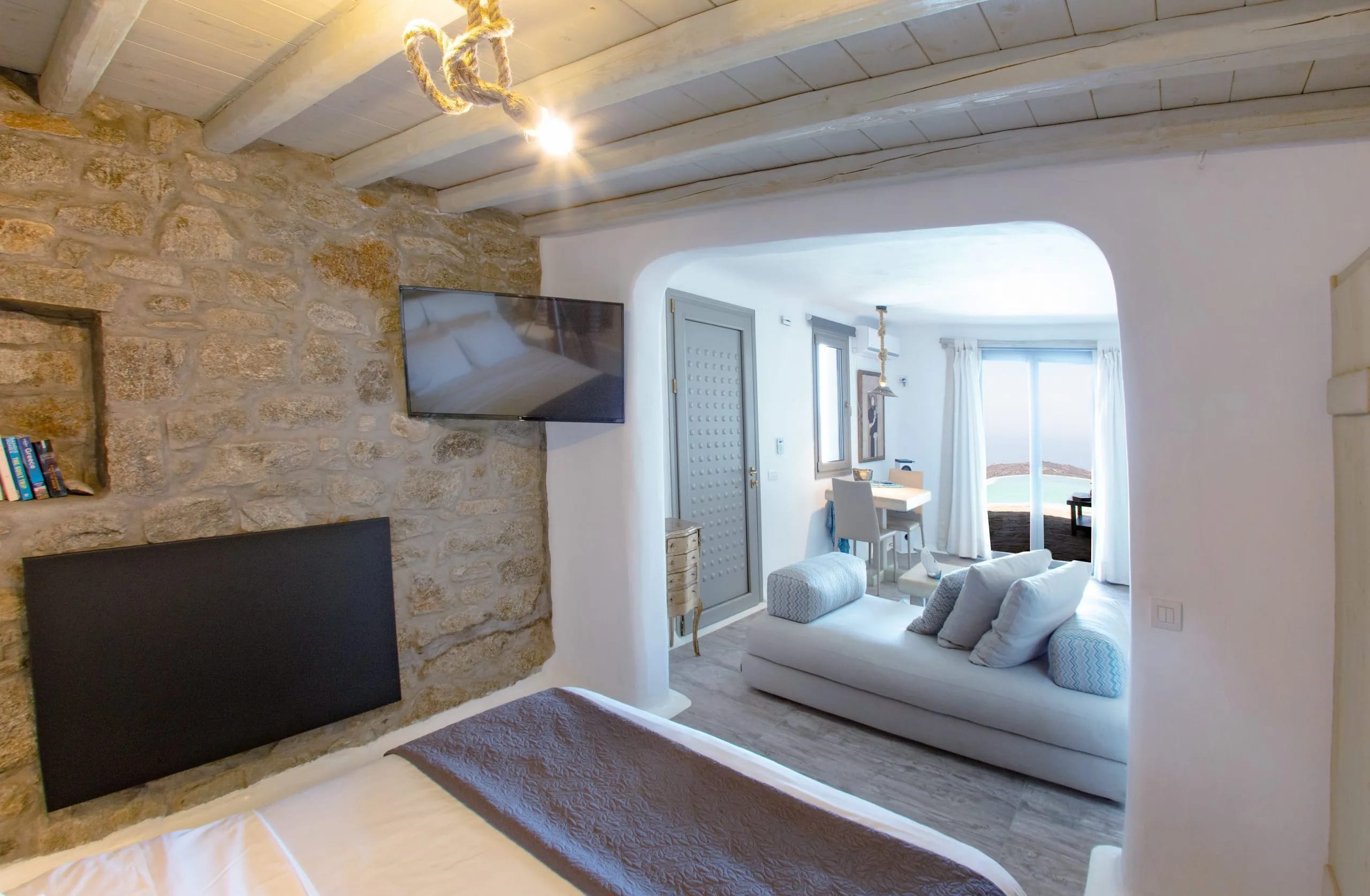 a bedroom with a large mirror