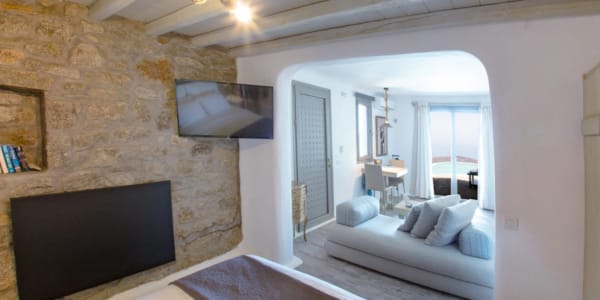 a bedroom with a large mirror