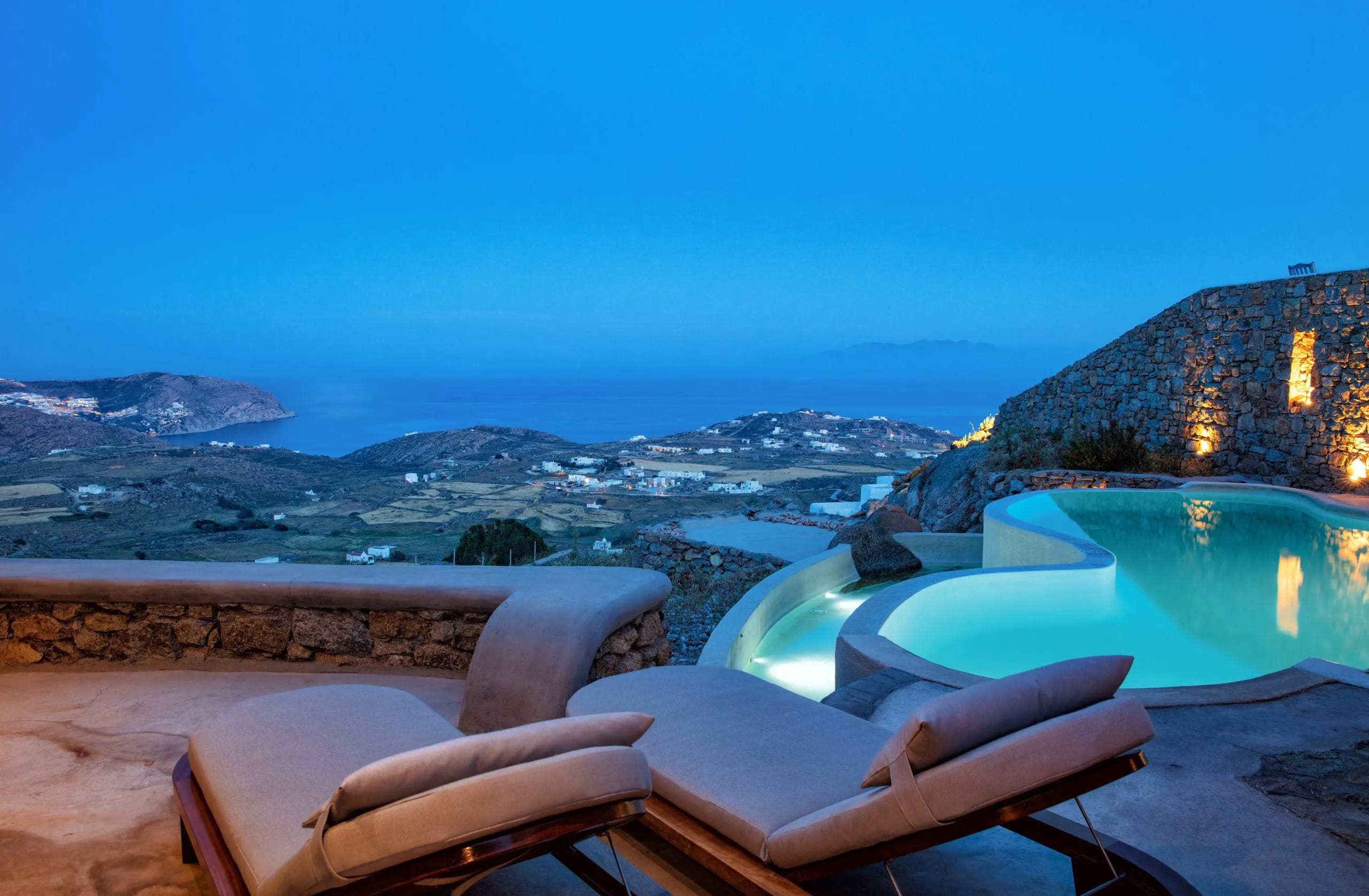 a person's feet on a ledge overlooking a city