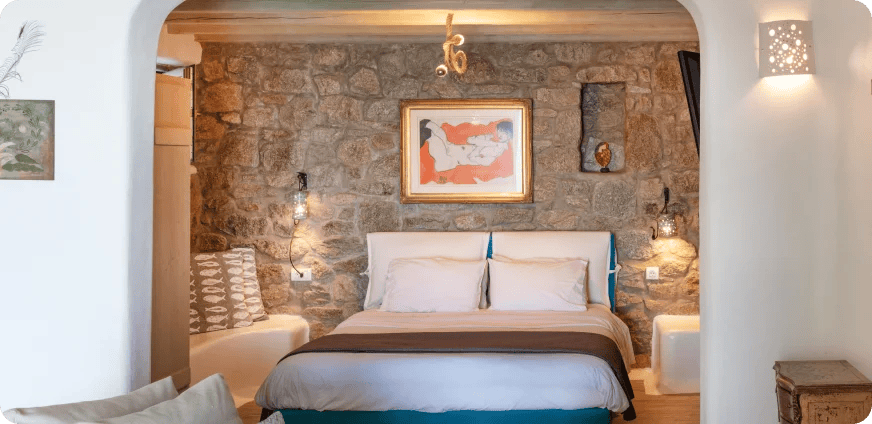 a bedroom with a bed and a fireplace