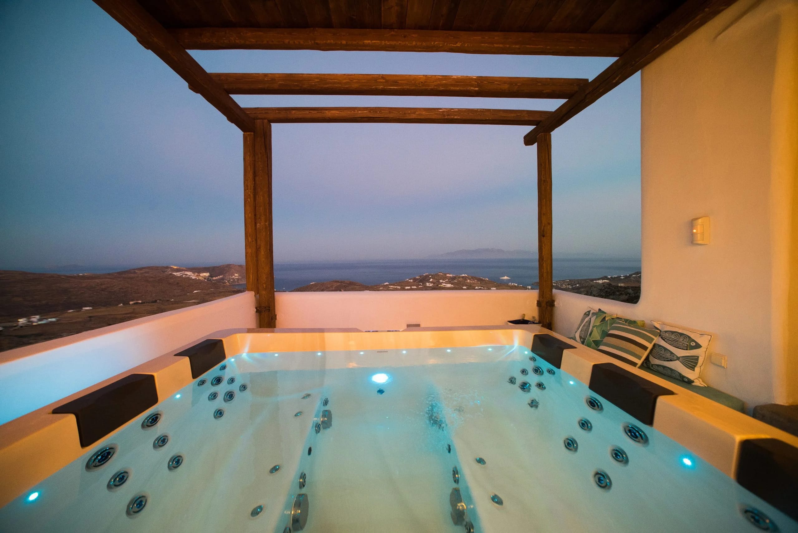 a pool with a view of the ocean and a city