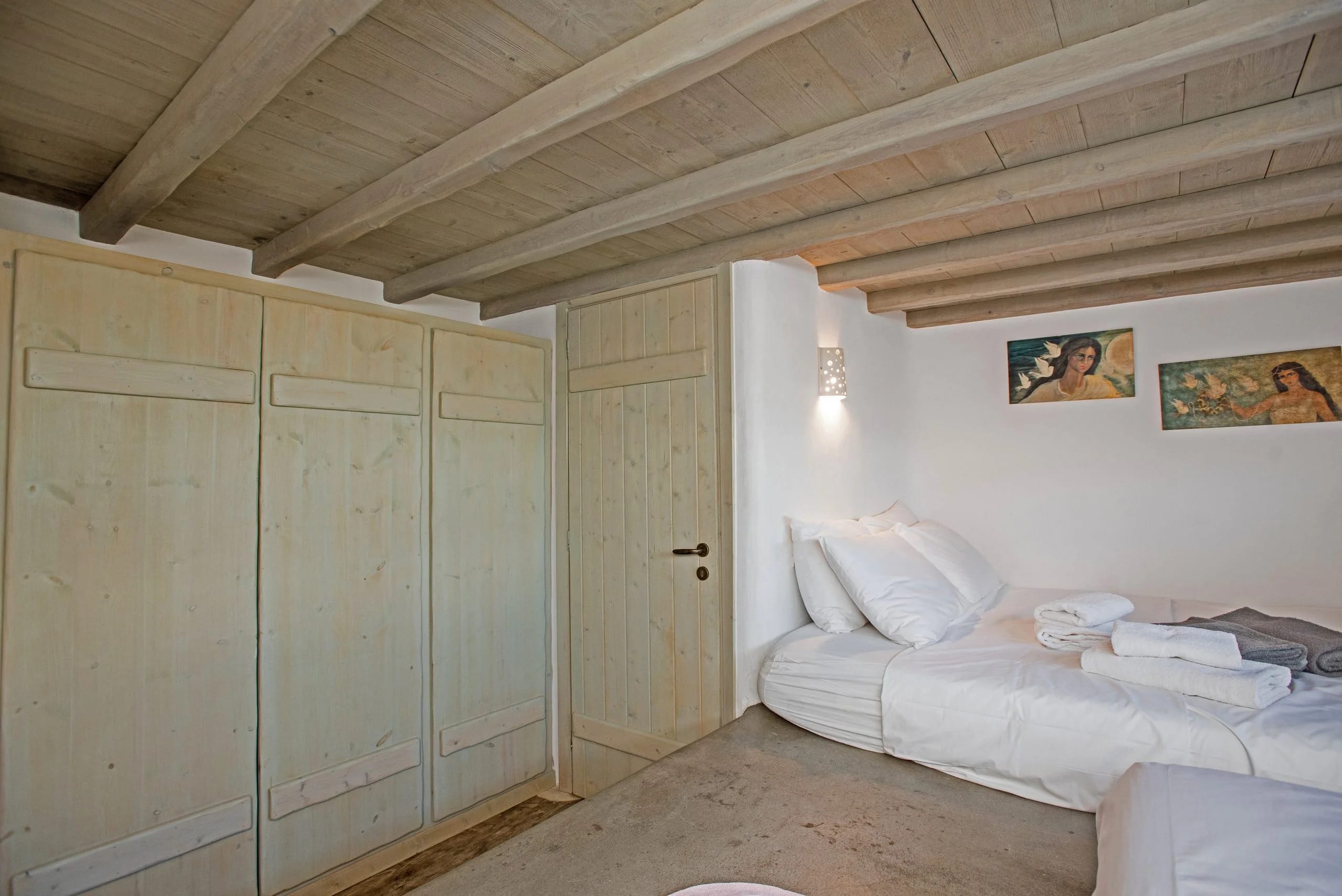 a room with a bed and a door