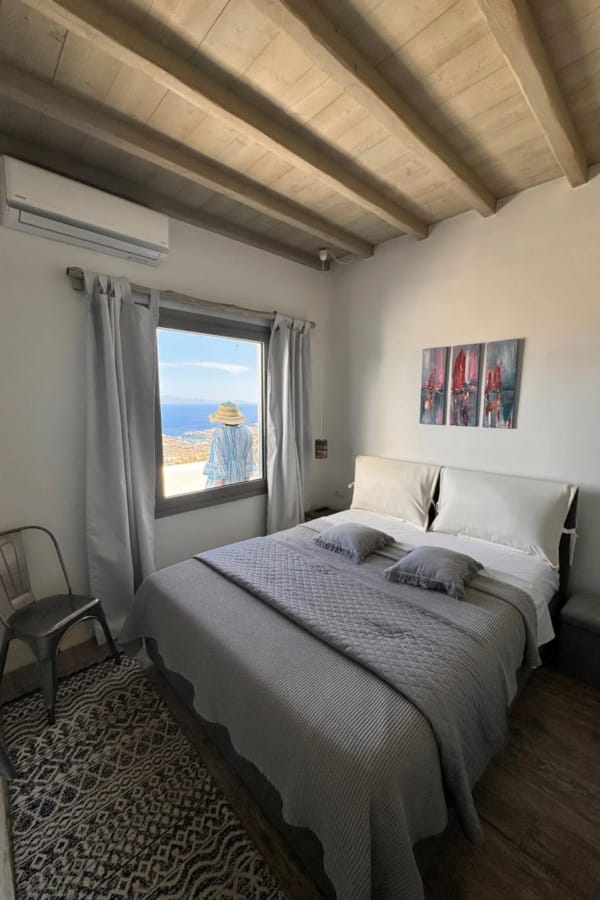 a bedroom with a bed and a chair