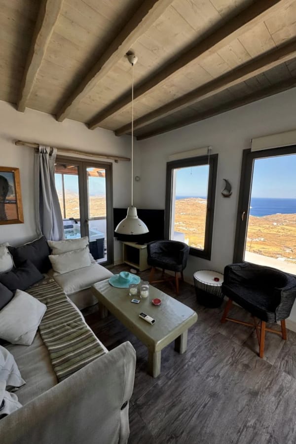 a living room with a view of the ocean
