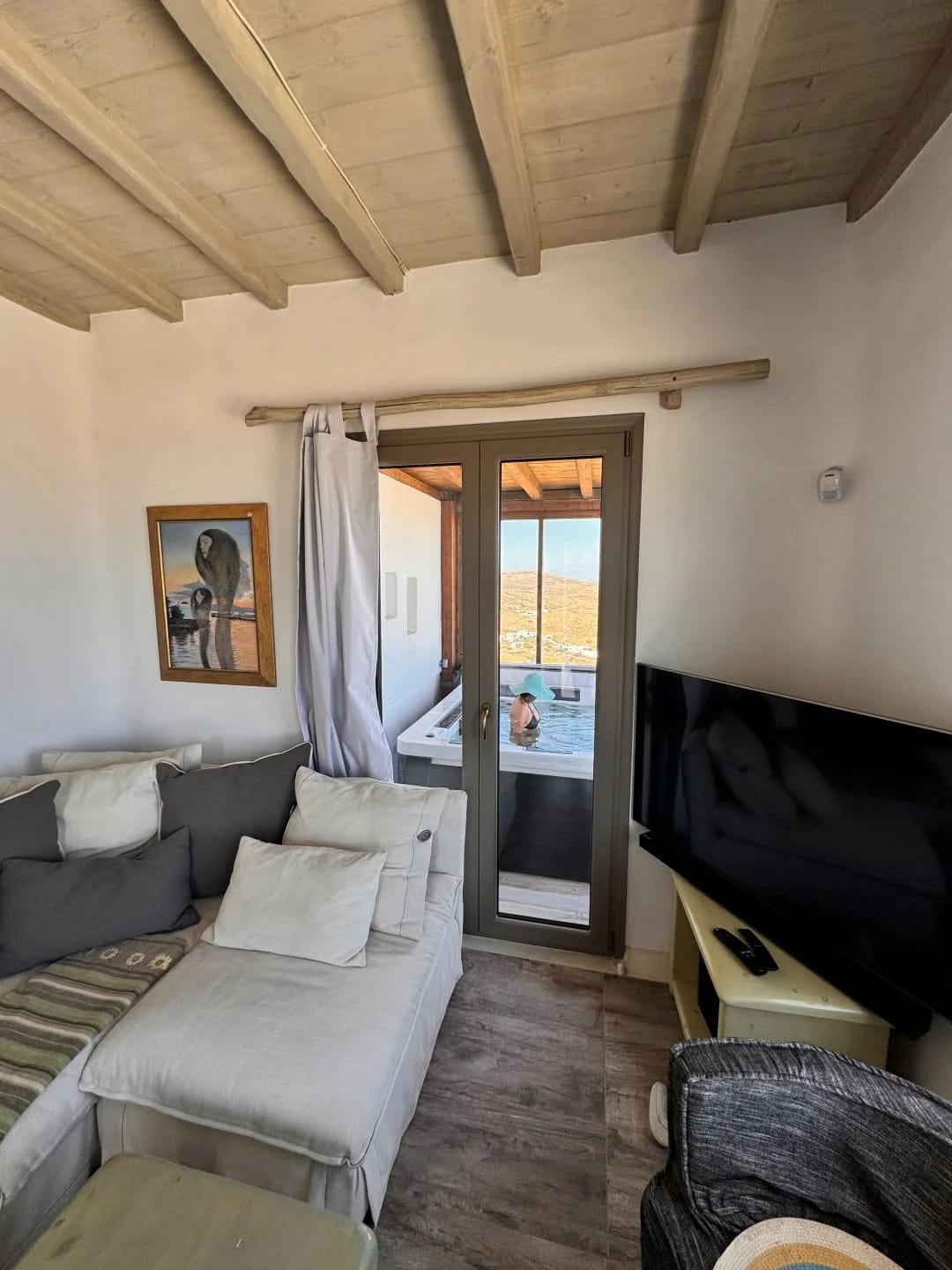 a living room with a couch and a tv