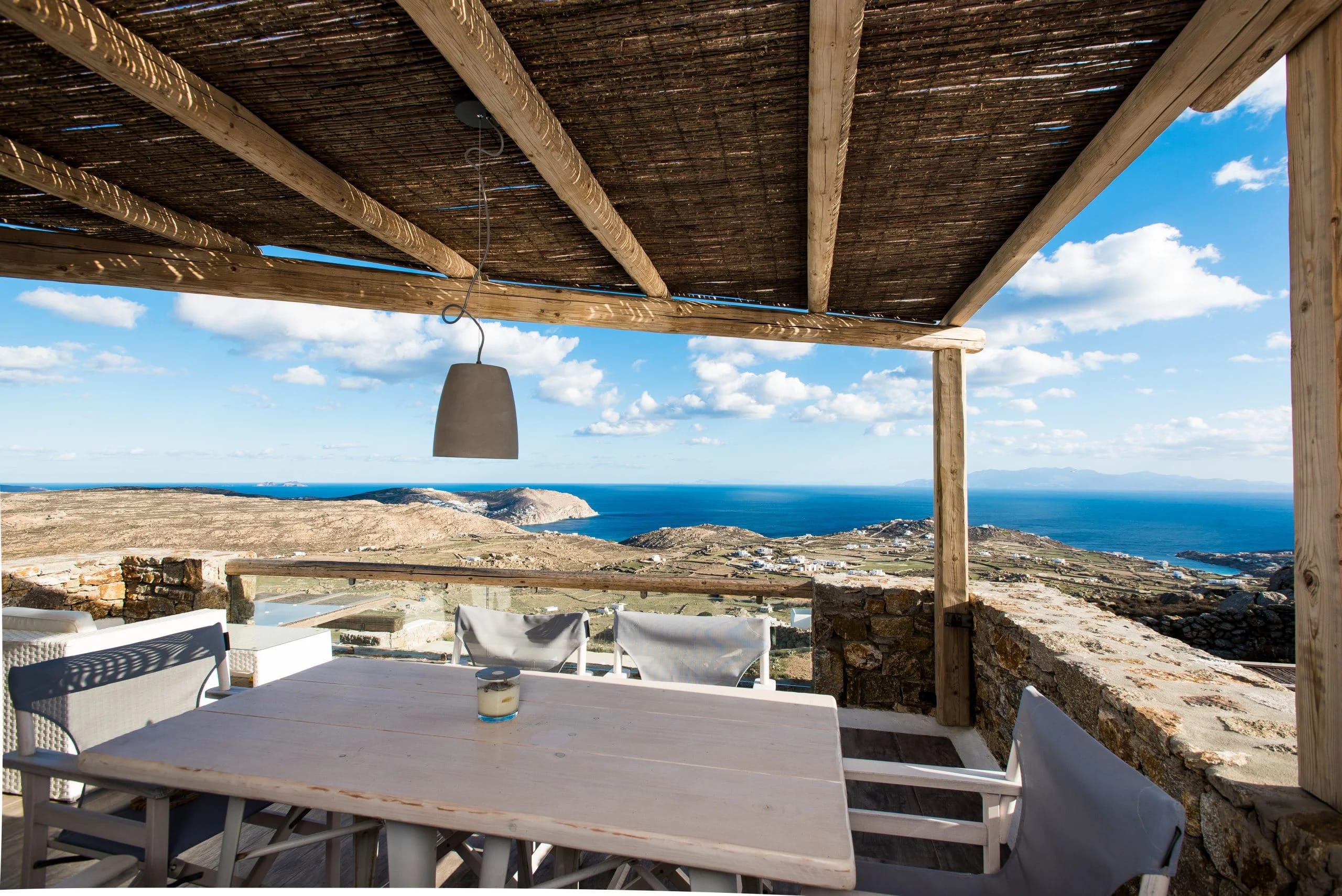 a table and chairs on a beach