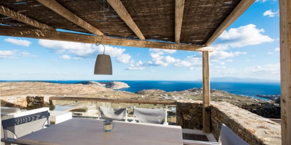 a table and chairs on a beach