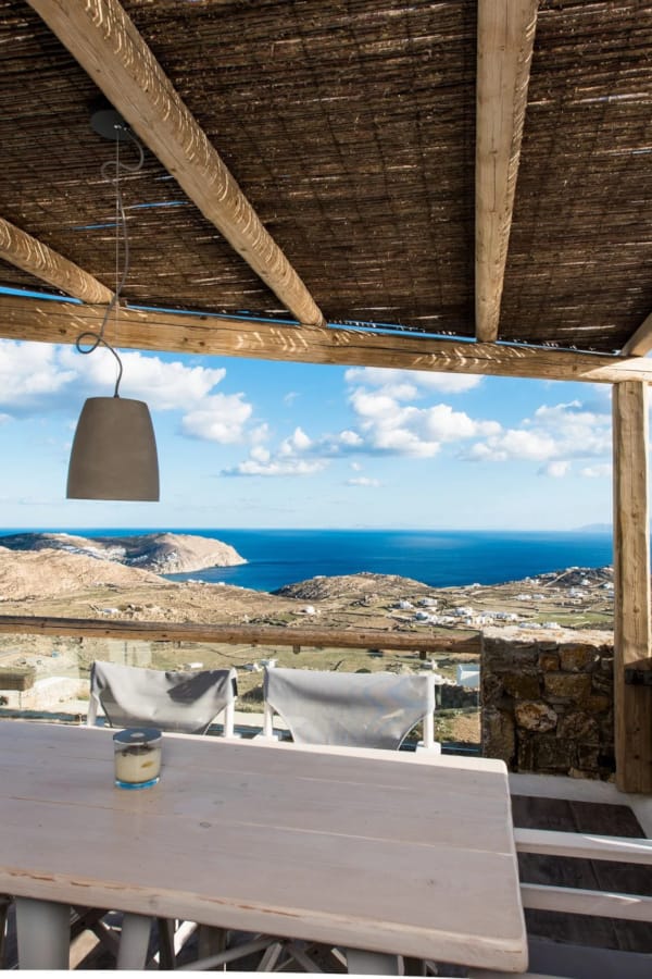 a table and chairs on a beach