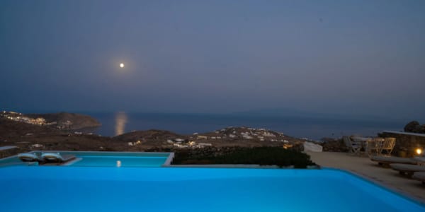 a body of water with a land in the back