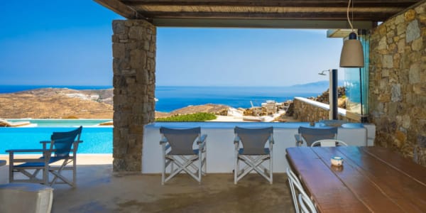 a patio with tables and chairs
