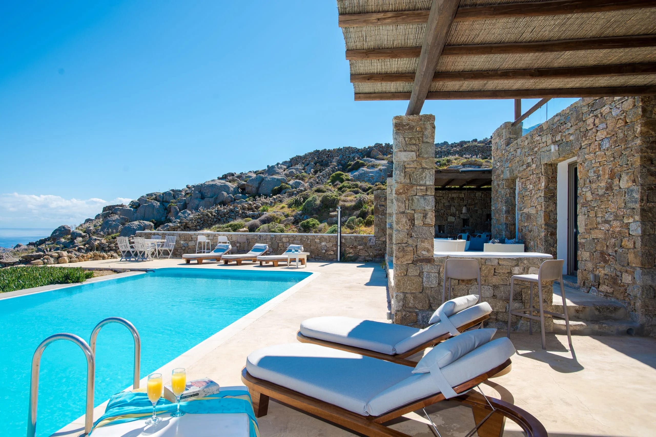 a pool with chairs and a deck