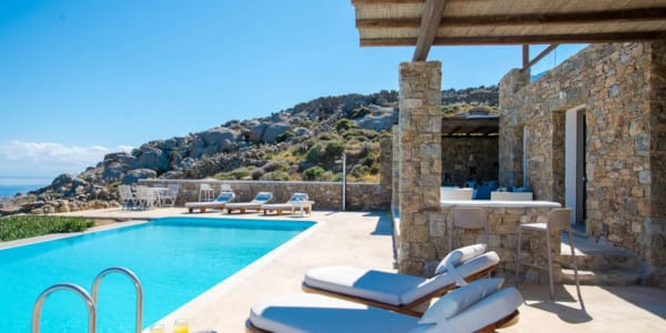 a pool with chairs and a deck