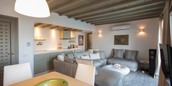 a living room with a large chandelier and a couch