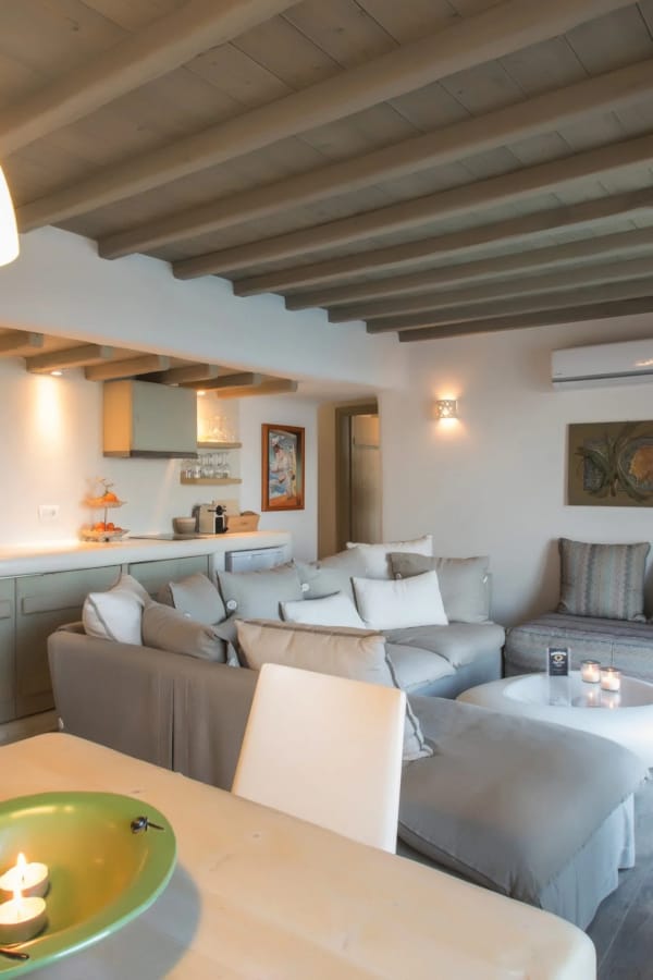 a living room with a large chandelier and a couch