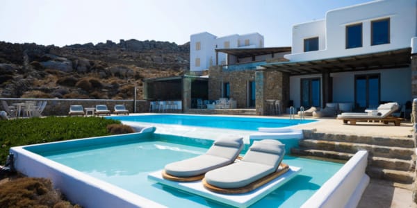 a swimming pool in front of a house