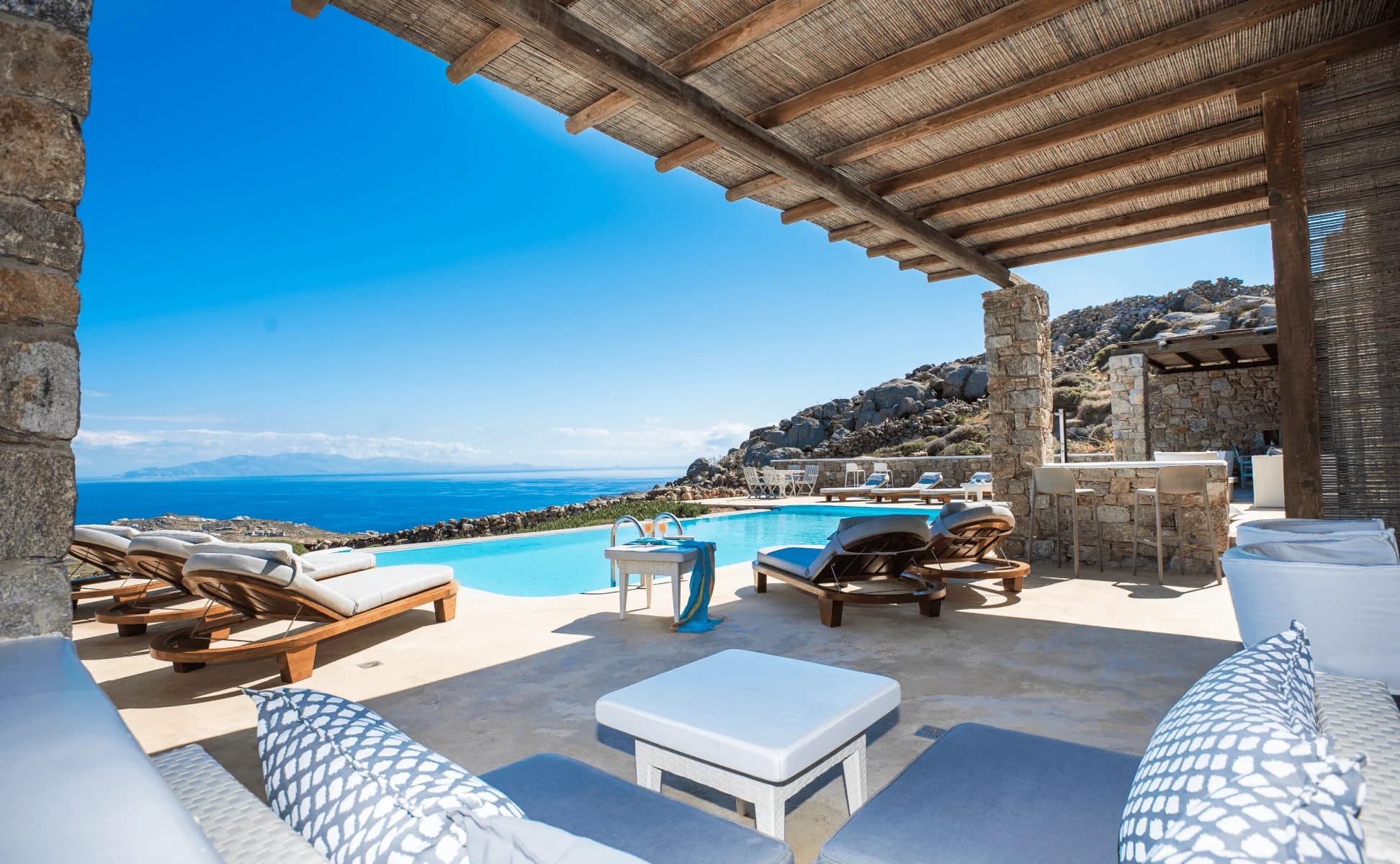 a pool with chairs and a table