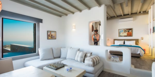 a living room with a tv and couches