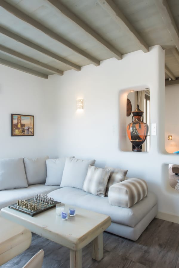 a living room with a tv and couches