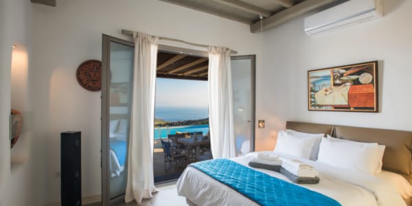 a bedroom with a large window