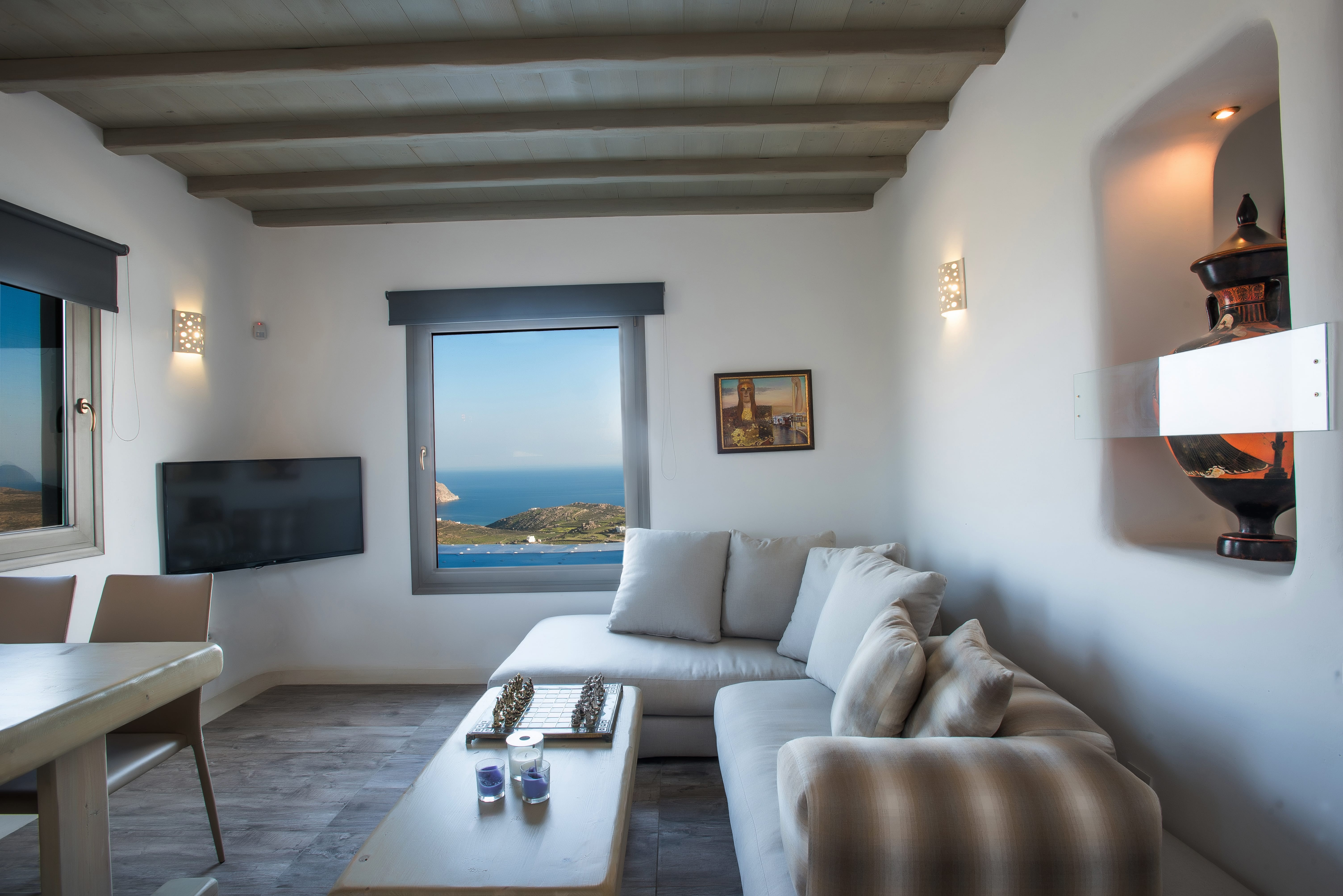 a living room with a large painting