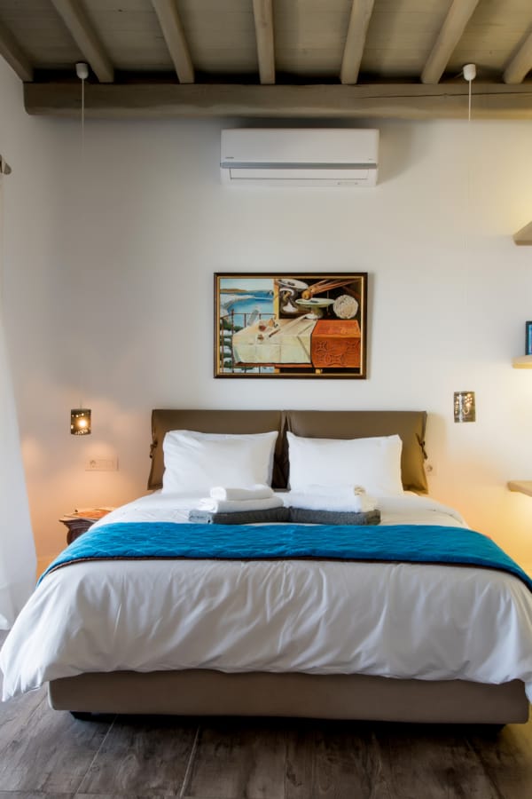 a bedroom with a bed and a bookcase