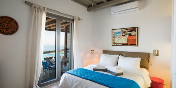 a bedroom with a bed and a door