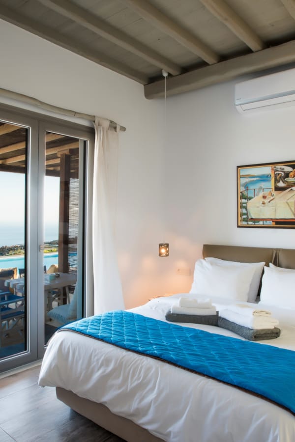 a bedroom with a bed and a door