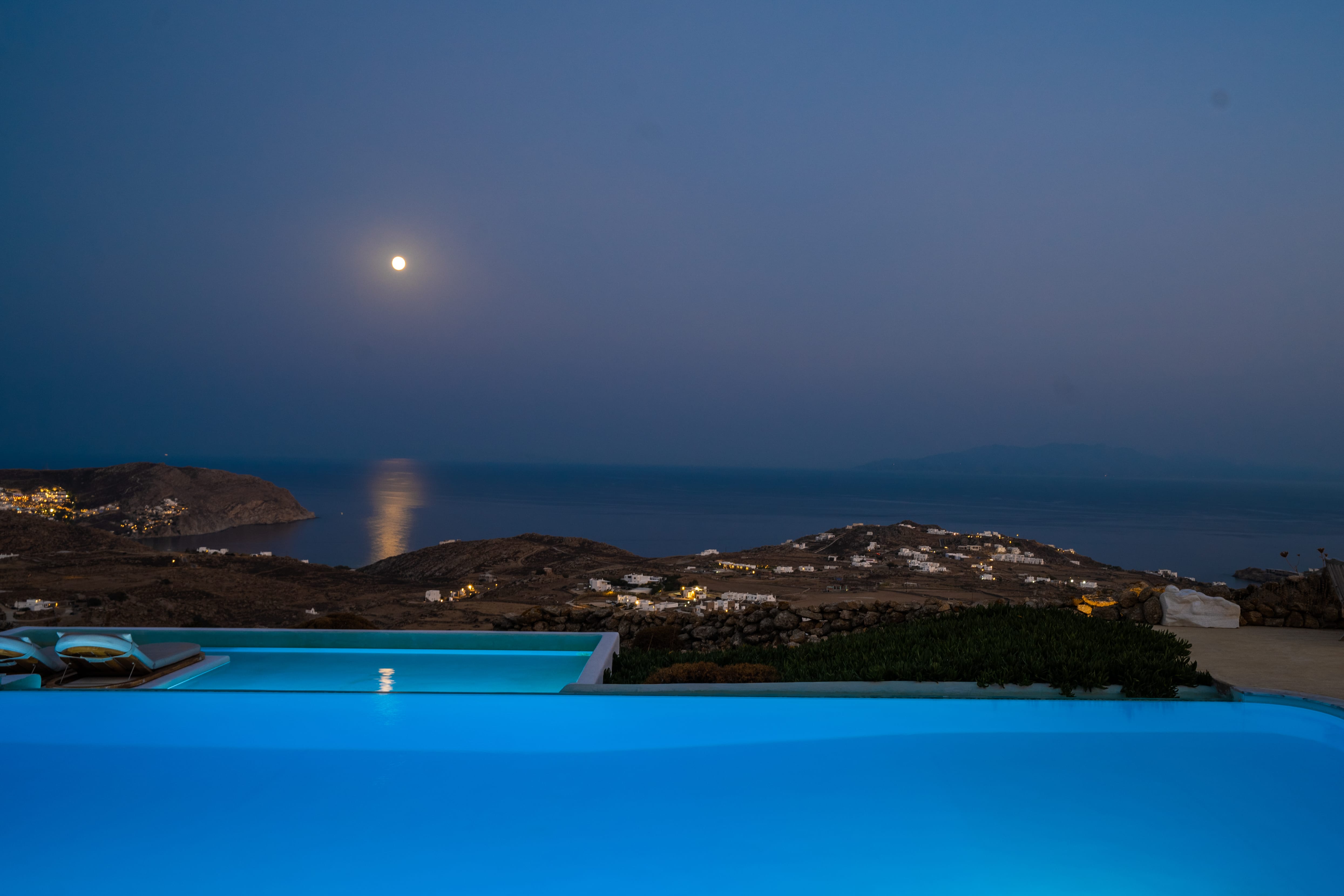 a body of water with a land in the back