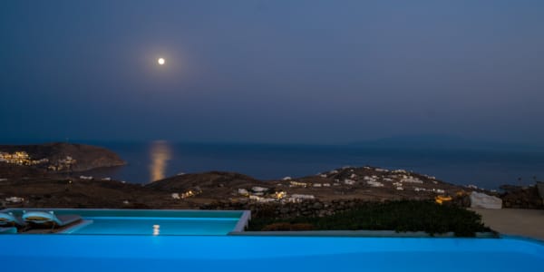 a body of water with a land in the back