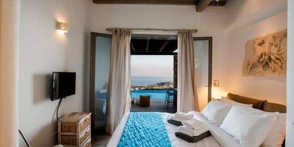 a bedroom with a large window