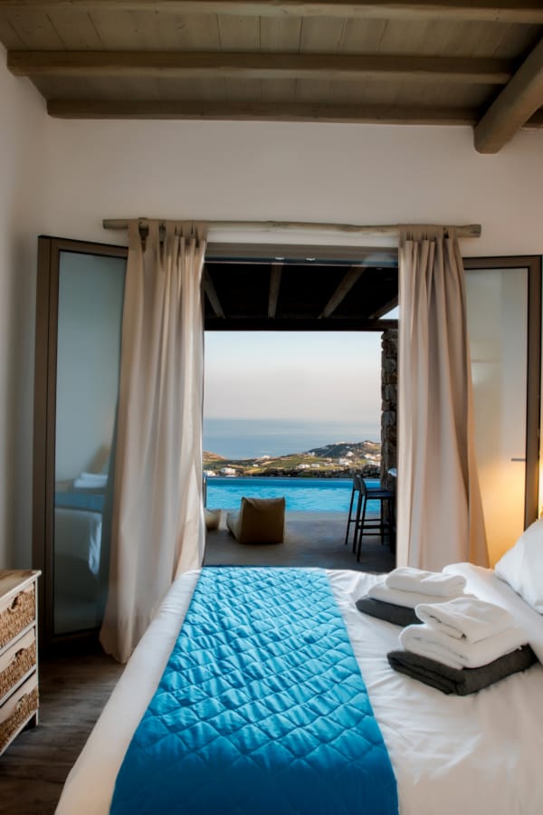 a bedroom with a large window