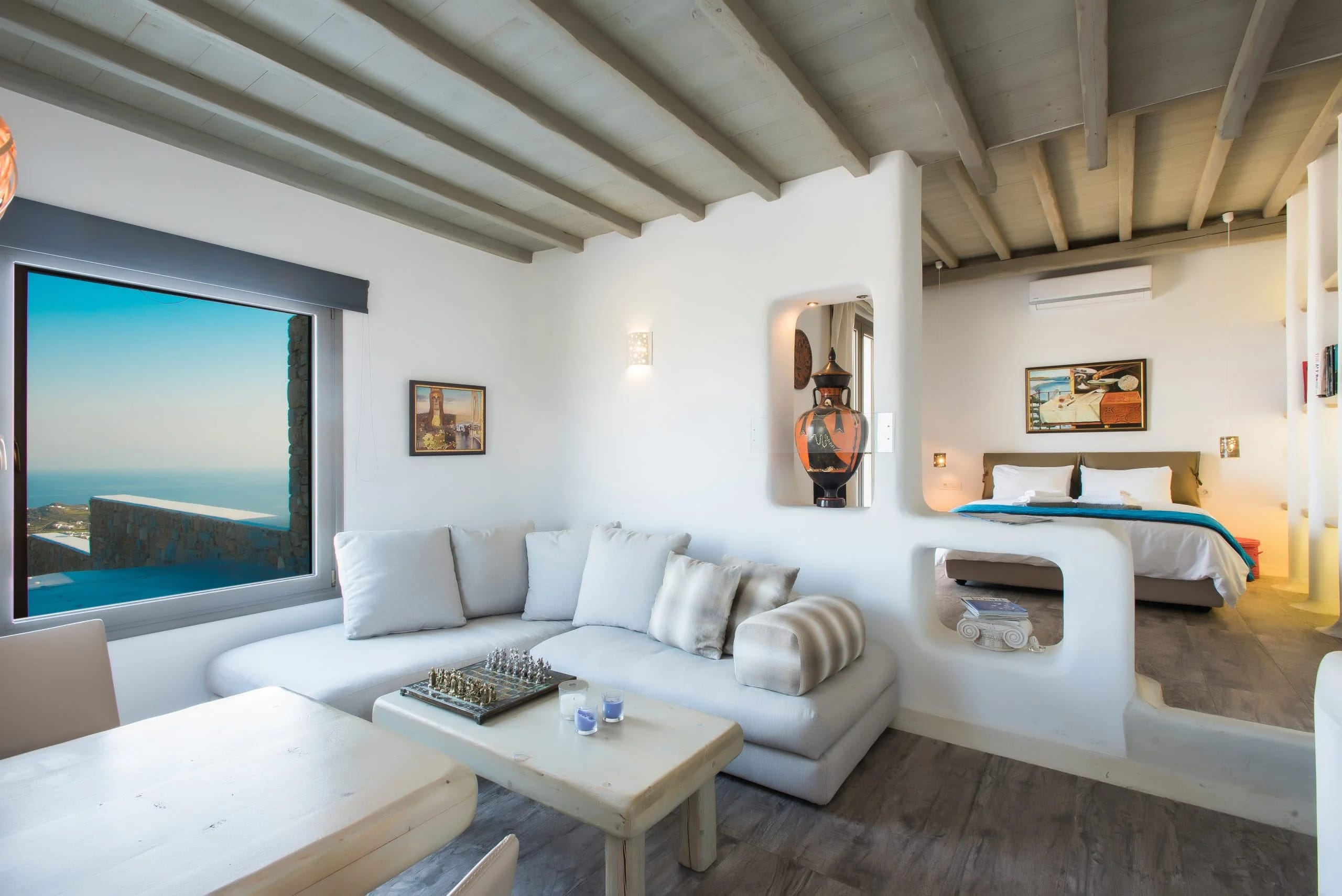 a living room with a tv and couches